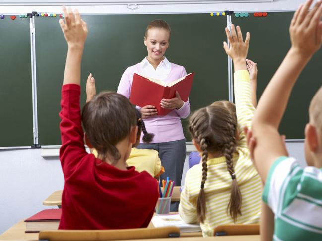 Generic image of teacher teaching students inside school classroom.