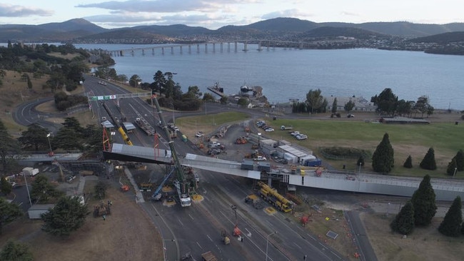 Two cranes lift the final span on the Bridge of Remembrance into place at the Hobart Cenotaph this morning. Picture: HOBART CITY COUNCIL