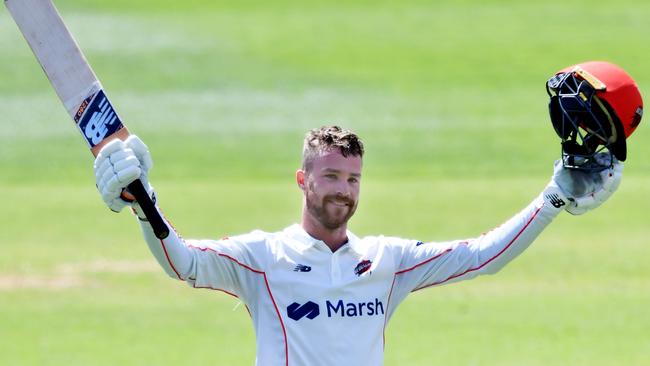 West Torrens captain Daniel Drew celebrates a century for the SA Redbacks. Picture: Mark Brake