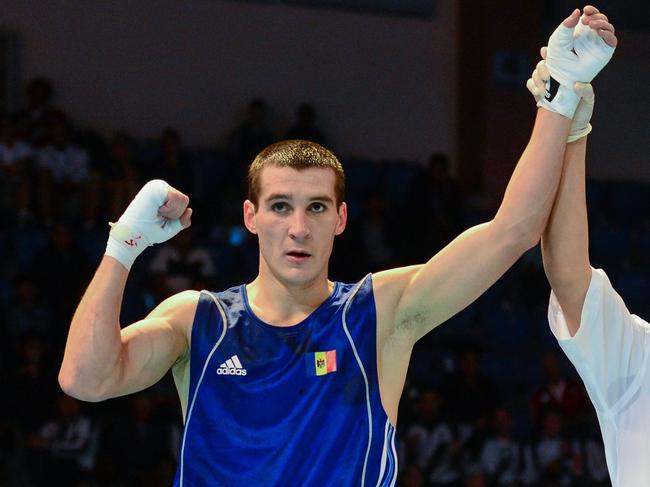 16 October 2013; Vasili Belous, left, Moldova, celebrates after beating Jamontay Clark, USA, in their 69Kg bout. AIBA World Boxing Championships Almaty 2013, Almaty, Kazakhstan. Picture credit: Paul Mohan / SPORTSFILE (Photo by Sportsfile/Corbis/Sportsfile via Getty Images)