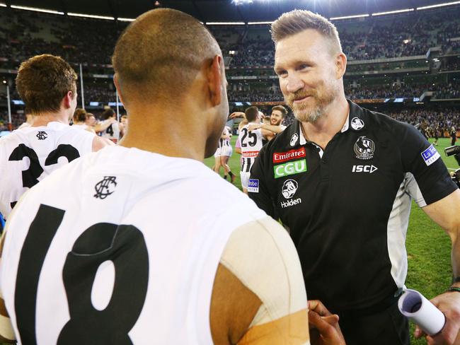 MELBOURNE, VICTORIA - SEPTEMBER 21:  Magpies head coach Nathan Buckley celebrates the win with Travis Varcoe of the Magpies during the AFL Preliminary Final match between the Richmond Tigers and the Collingwood Magpies on September 21, 2018 in Melbourne, Australia.  (Photo by Michael Dodge/AFL Media/Getty Images)