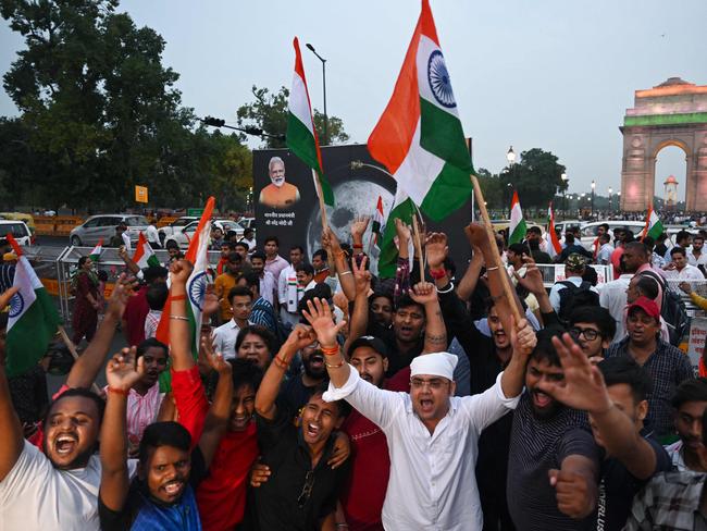 Indians took to the street to celebrate the historic landing. Picture: AFP