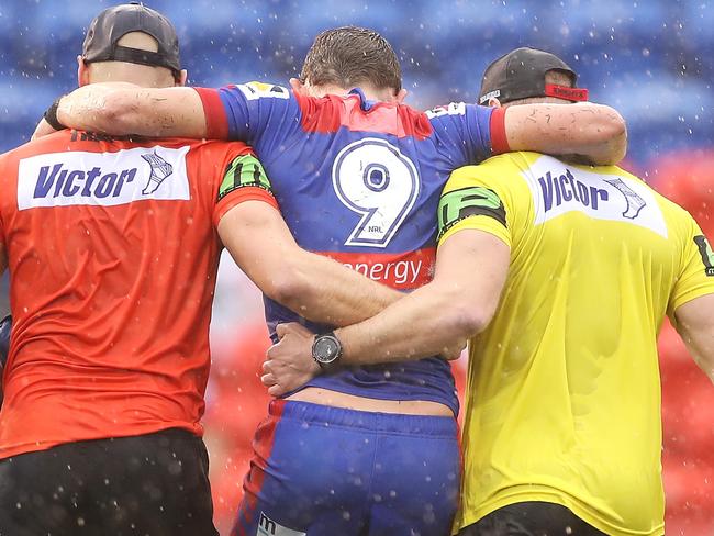 NEWCASTLE, AUSTRALIA - JULY 26: Andrew McCullough of the Knights is helped from the field with an injury during the round 11 NRL match between the Newcastle Knights and the Canterbury Bulldogs at McDonald Jones Stadium on July 26, 2020 in Newcastle, Australia. (Photo by Mark Kolbe/Getty Images)