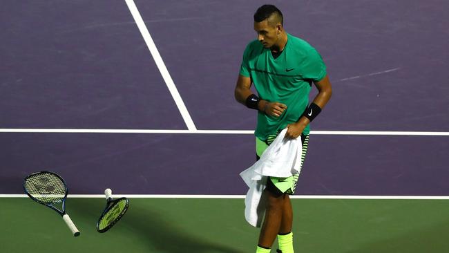 Nick Kyrgios having another tantrum: throwing his racquet and hitting the other one after losing a set during the Miami Open. Picture: AFP