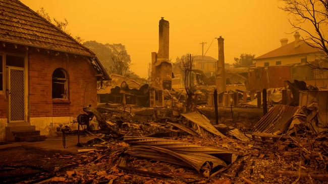 The remains of burnt out buildings are seen along main street in the town of Cobargo, NSW. Picture: AFP