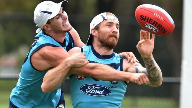 Jackson Thurlow battles Zach Touhy at Geelong training. Picture: Jay Town.