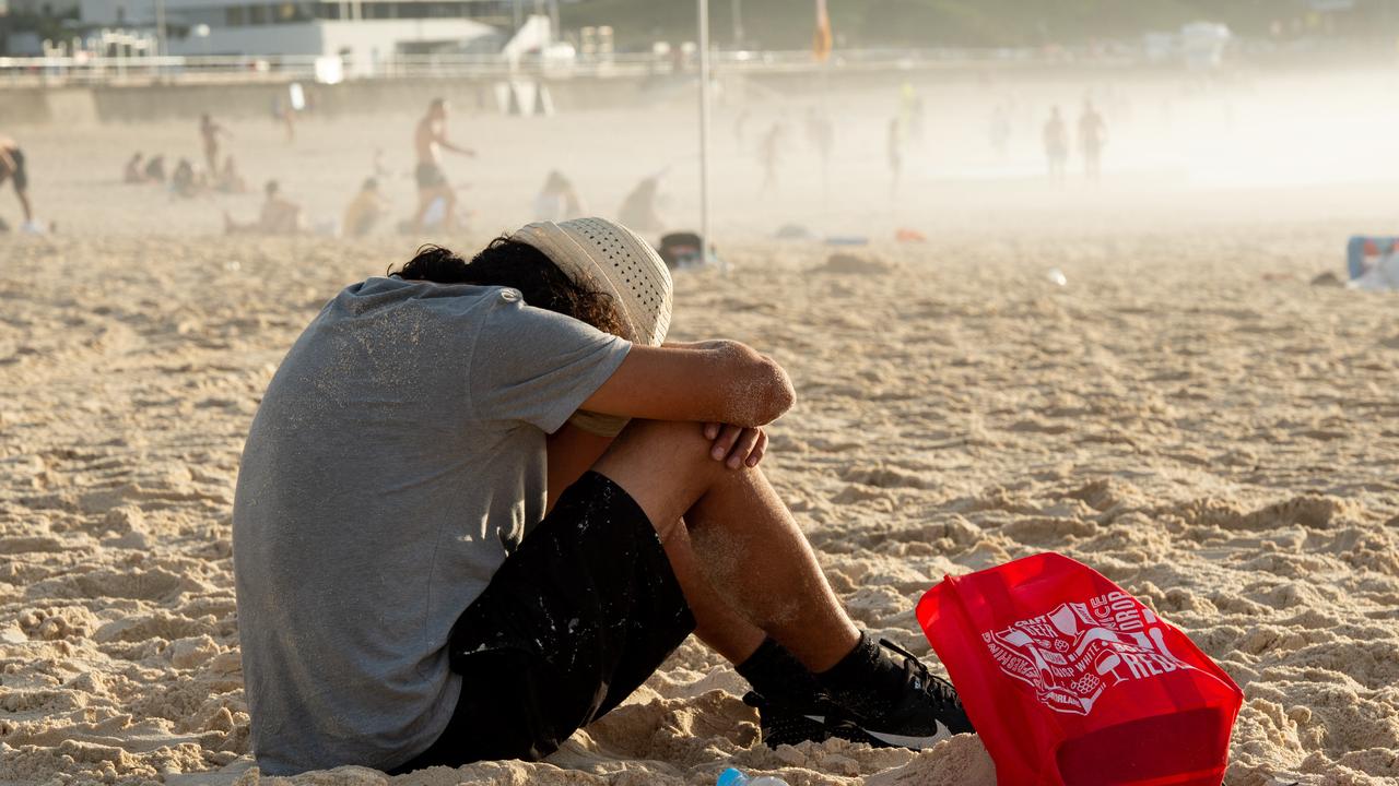 A man catches a few Z’s on Bondi Beach. Picture: Monique Harmer