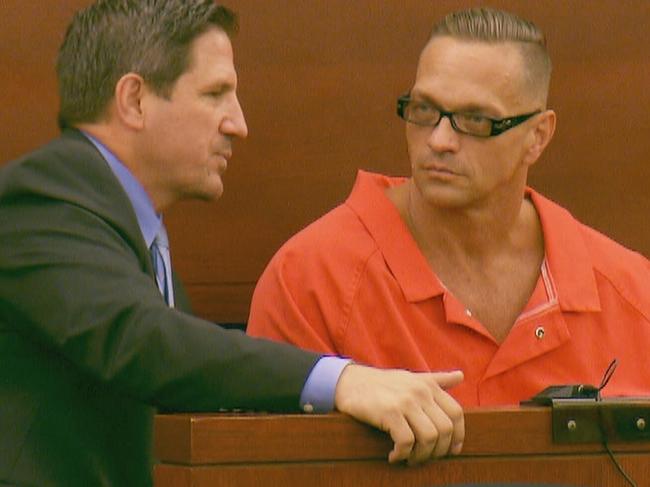 Dozier talks to a member of his legal team at his 2007 trial for the murder of 22-year-old Jeremiah Miller. Picture: Supplied