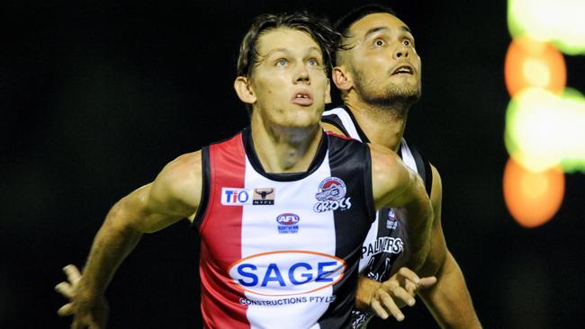 Sam Smith and his Palmerston rival have eyes only for the ball in this 2018 clash at TIO Stadium. Picture: Felicity Elliott