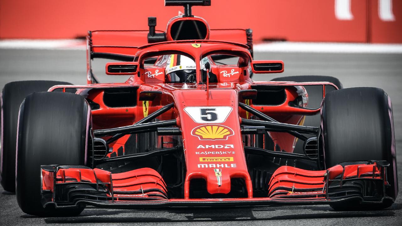 Ferrari driver Sebastian Vettel steers his car during the first practice session.