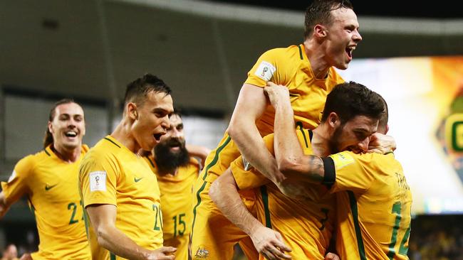 SYDNEY, AUSTRALIA - MARCH 28:  Mathew Leckie of the Socceroos celebrates with team mates after scoring the second goal during the 2018 FIFA World Cup Qualifier match between the Australian Socceroos and United Arab Emirates at Allianz Stadium on March 28, 2017 in Sydney, Australia.  (Photo by Matt King/Getty Images) *** BESTPIX ***