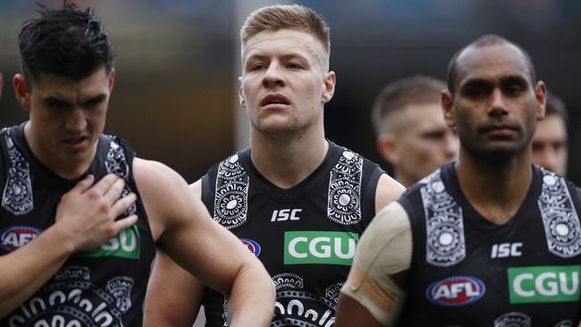 Jordan De Goey and his Collingwood teammates leave the MCG on Saturday. Picture: Daniel Pockett (AAP).