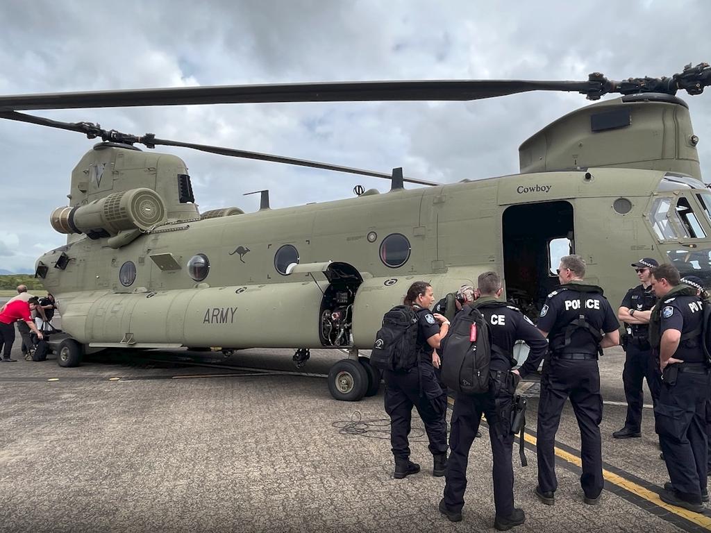 Police and other emergency personnel board Chinook helicopters to fly to the township of Wujal Wujal. Picture: Queensland Police Service