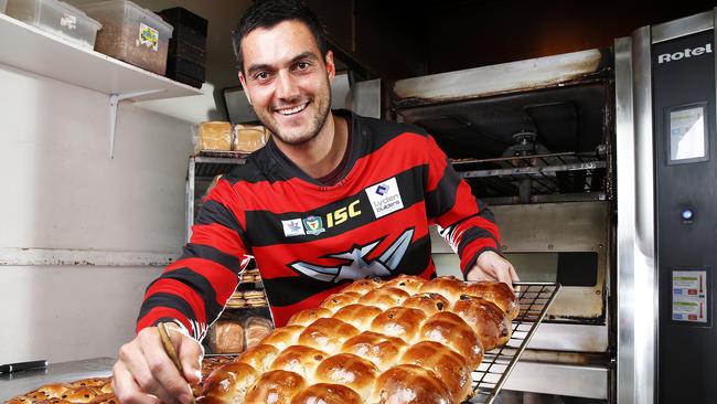A baker by trade, Lauderdale forward Phillip Bellchambers is up to his elbows in flour this week pumping out hot cross buns for Easter. Picture: Zak Simmonds