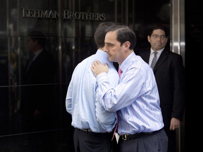 Two men hug outside of Lehman Brothers headquarters in New York on September 15, 2008, after the investment bank declared bankruptcy, a casualty of the US economic crisis. Picture: AFP Photo/Nicholas Roberts