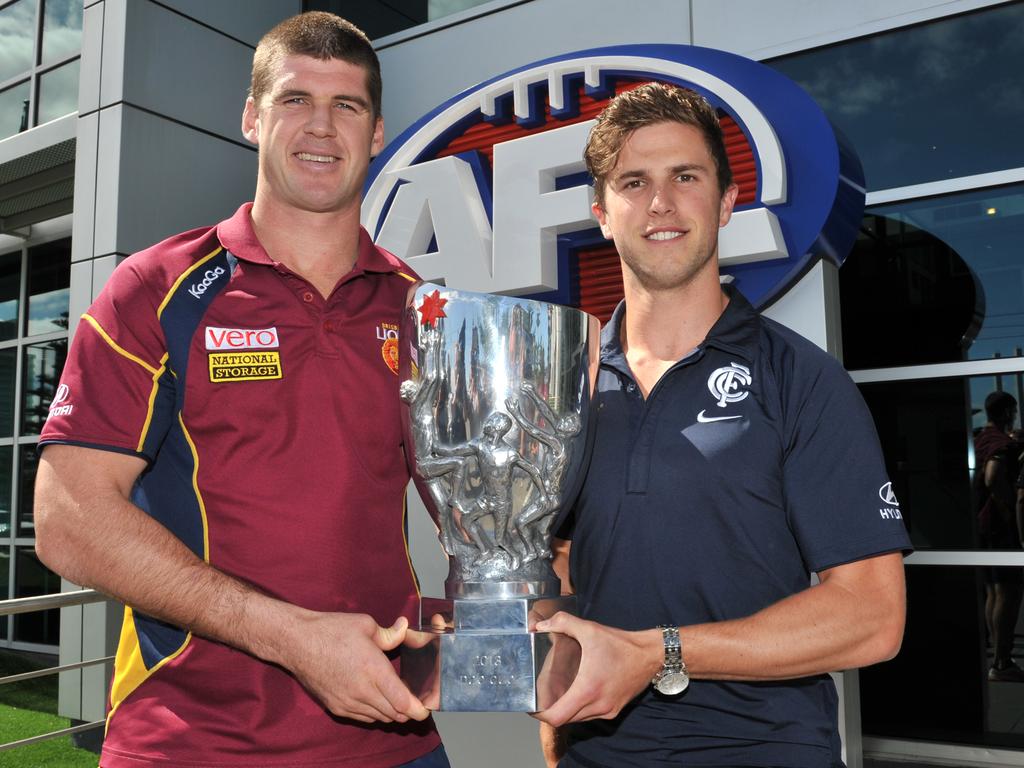 Marc Murphy (right) and Jonathon Brown with the NAB Cup in 2013. The Lions and Blues played in the last NAB Cup Grand Final. Picture: Julian Smith