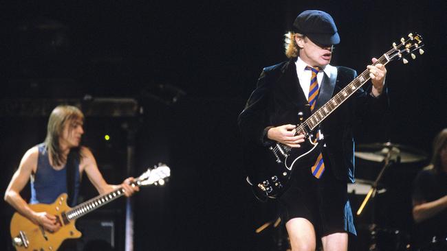 Malcolm, left, and Angus Young performing at Melbourne’s Rod Laver Arena in 2001. Picture: Martin Philbey