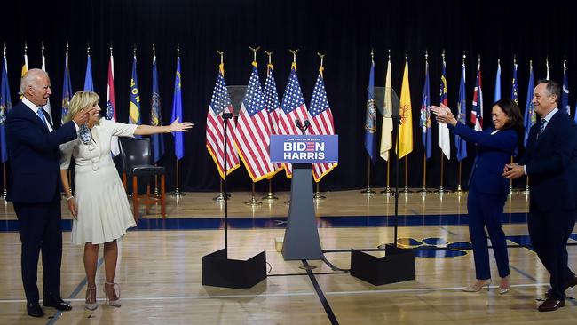 Joe Biden and his wife Jill greet Kamala Harris, and her husband Douglas Emhoff. Picture: AFP.