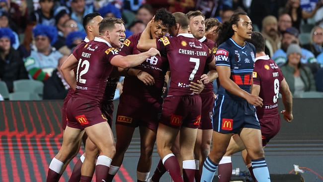 Selwyn Cobbo celebrates a try with his Maroons teammates. Picture: Getty Images