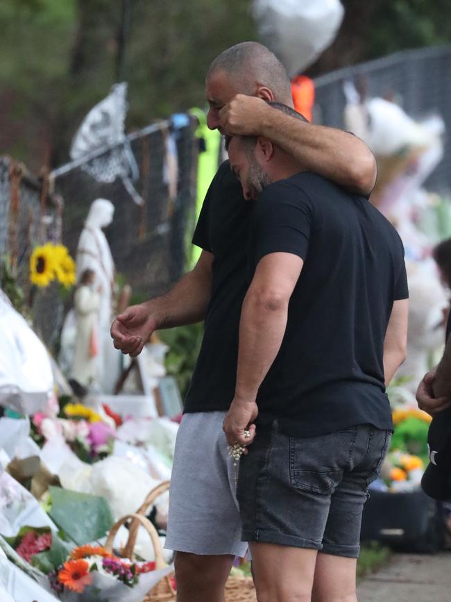 Her husband Danny is also comforted. Picture: John Grainger