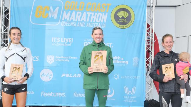 Gold Coast Marathon ASICS half marathon winner Keira D’Amato (centre) - who ran a Gold Coast and United States half marathon record - with runner up Leanne Pompeani (left) and third placegetter Ellie Pashley. Picture: Richard Gosling