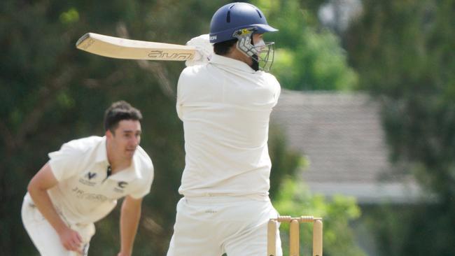 Brett Forsyth dispatches a ball to the fence for Dandenong. Picture: Valeriu Campan