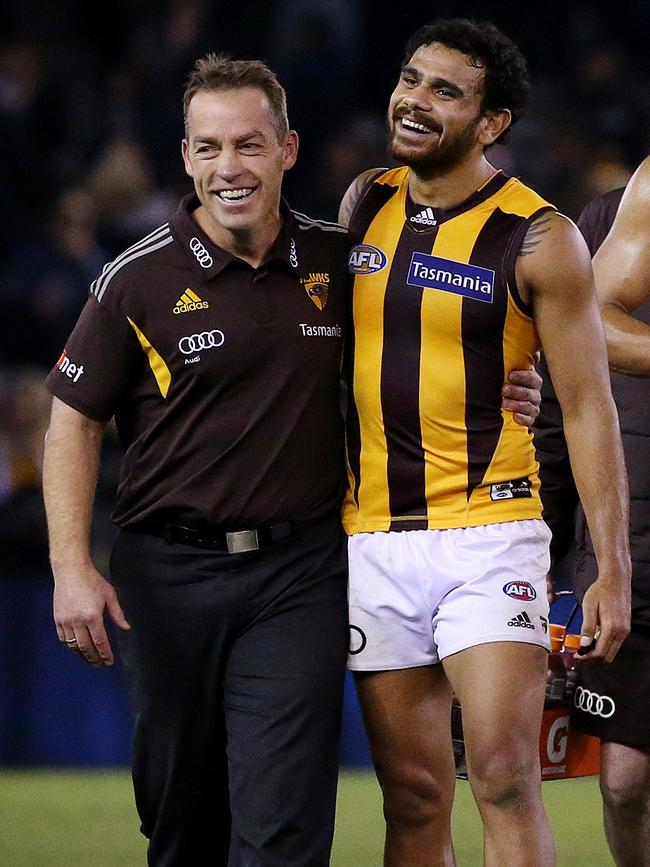 Hawthorn's Cyril Rioli gets a hug from coach Alastair Clarkson after a 2016 win. Picture: Colleen Petch.