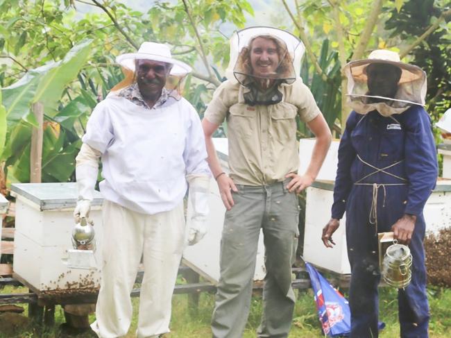 BEEKEEPING: On February 12, 2021, Dr Cooper Schouten (middle) will give the SCU graduate address at the first graduation ceremony the university has had since COVID-19. Dr Schouten's research focused on beekeeping in PNG and how his can make a positive impact of some of the poorest communities.