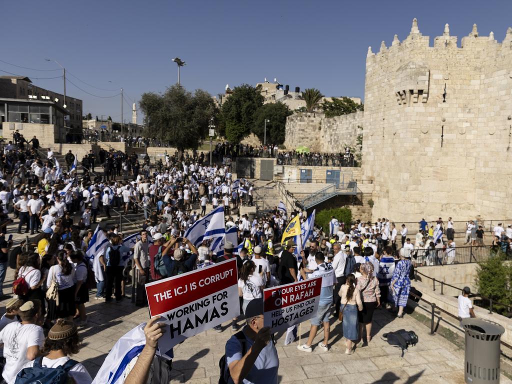 The crowd, draped in thousands of Israeli flags, gathered outside the Old City’s Damascus Gate, chanting slogans that included anti-Arab rhetoric.