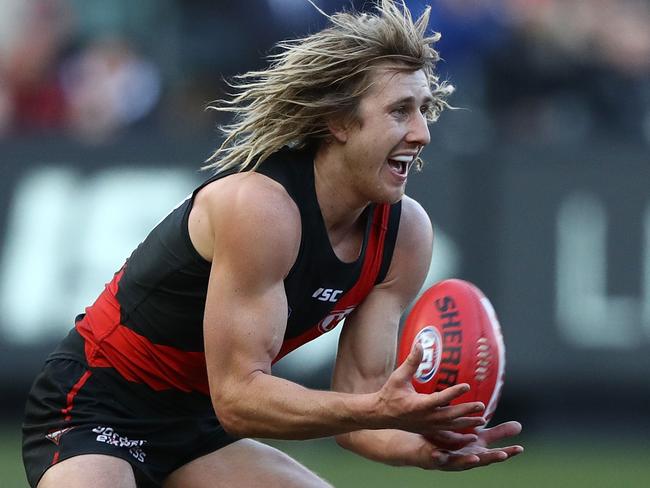 MELBOURNE, AUSTRALIA - AUGUST 05: Dyson Heppell of the Bombers takes the ball during the round 20 AFL match between the Essendon Bombers and the Carlton Blues at Melbourne Cricket Ground on August 5, 2017 in Melbourne, Australia.  (Photo by Robert Cianflone/Getty Images)