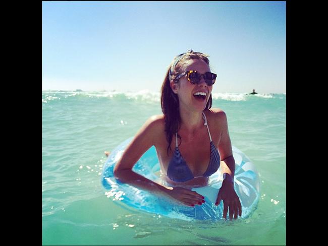SUMMER is here and the weather is fine, check out all these celebs lapping up the sunshine in their favourite beach and poolside spots. Demi Harman enjoys her doughnut in the summer sun. Picture: Instagram/ Demi Harman