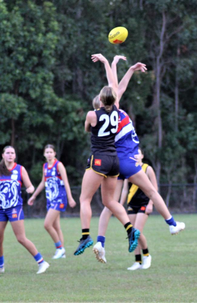 Billi Hutton leaps for possession from the ruck.