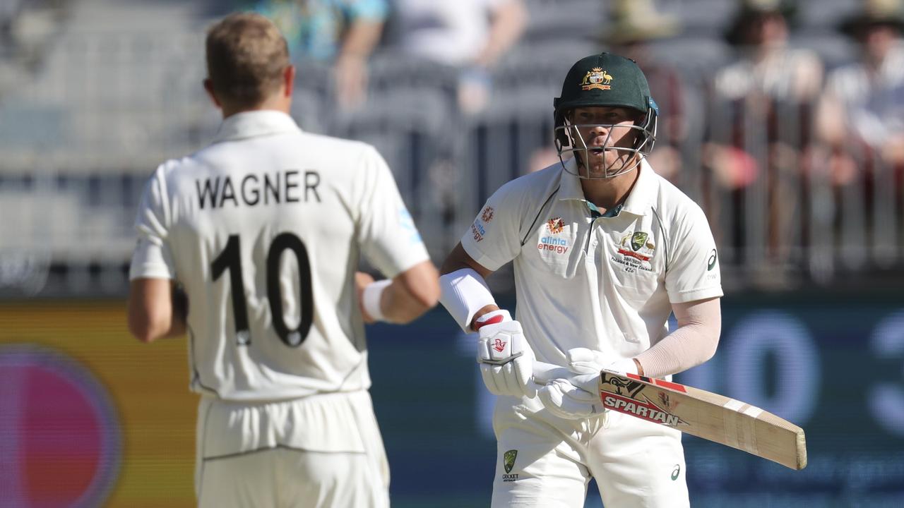 Wagner and David Warner face off after a short ball. Photo: AP Photo/Trevor Collens