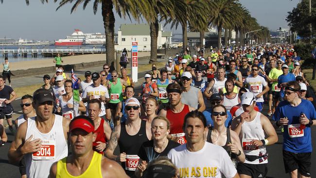 Nearly there ... runners approaching the halfway mark in the 2014 Melbourne Marathon. Picture:  Yuri Kouzmin