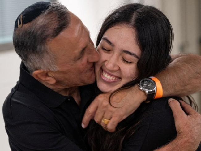 Noa Argamani, a rescued hostage embraces her father, Yakov Argamani, after the military said that Israeli forces have rescued four hostages alive from the central Gaza Strip, in Ramat Gan, Israel, in this handout image obtained by Reuters on June 8, 2024. Israeli Army/Handout via REUTERS    THIS IMAGE HAS BEEN SUPPLIED BY A THIRD PARTY