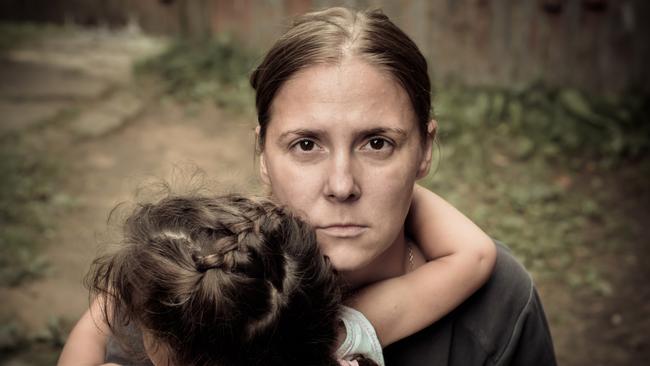 File photo of a woman holding a child. A Kingaroy grandmother, who asked to not be named, said she had reached breaking point in the rental crisis as her health deteriorates.