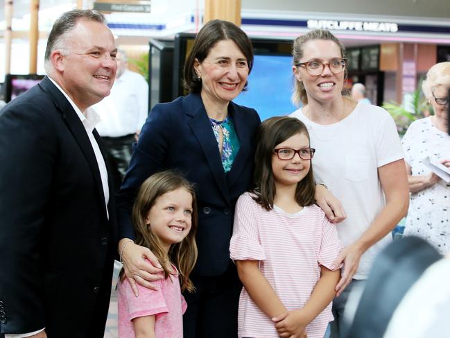 Premier Gladys Berejiklian with Terrigal MP Adam Crouch. The computers were stolen from a pre-polling station in the Terrigal electorate.