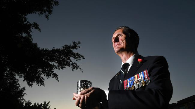 John Ryan at the service. “Driveways at Dawn” initiative throughout Hamilton Reach Community spirit drives range of ANZAC Day 2020 celebrations despite COVID-19 restrictions. Saturday April 25, 2020. (AAP image, John Gass)