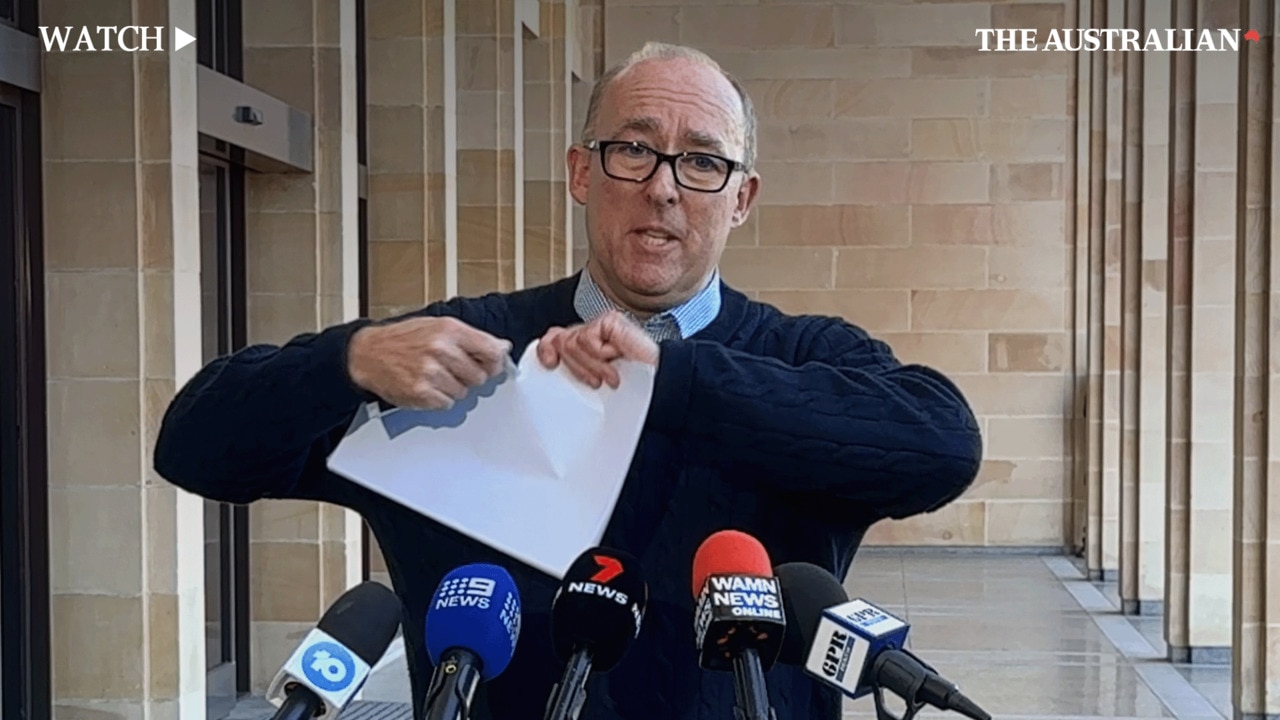 Professor Benjamin Smith tears up findings of the Murujuga Rock Art report