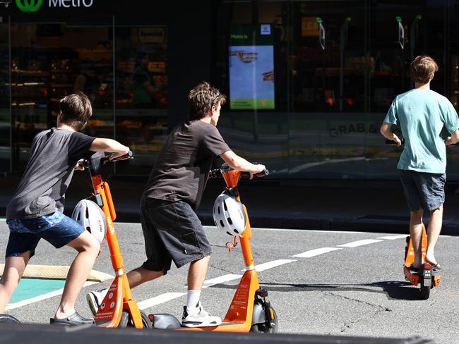 People riding escooters to go with a report about injuries sustained while riding them. Brisbane CBD Wednesday 3rd April 2024 Picture David Clark