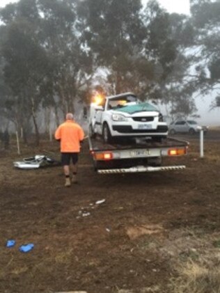 The car being towed from the site.