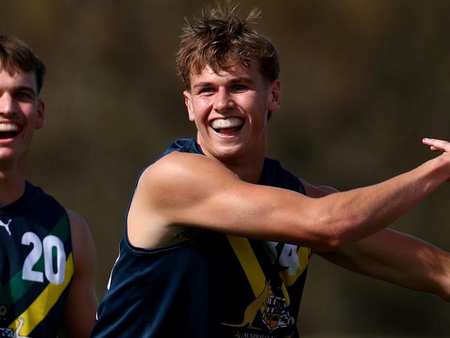 MELBOURNE, AUSTRALIA - APRIL 13: Cooper Duff-Tytler of the AFL National Academy is congratulated by team mates after kicking a goal during the Marsh AFL National Academy Boys match between Australia U18 and Richmond VFL at RSEA Park on April 13, 2025 in Melbourne, Australia. (Photo by Josh Chadwick/AFL Photos/via Getty Images)
