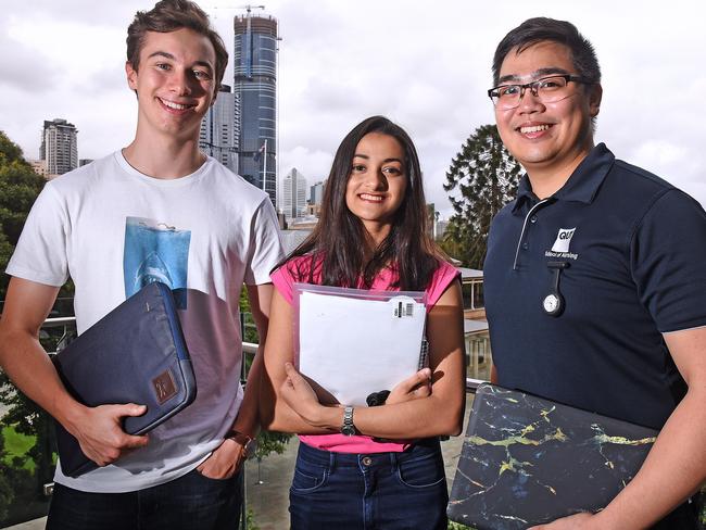 Students Charlie Dally-Watkins, Raina Ahmed and Ralph Teodoro at QUT Gardens Point campus. Picture: John Gass/AAP