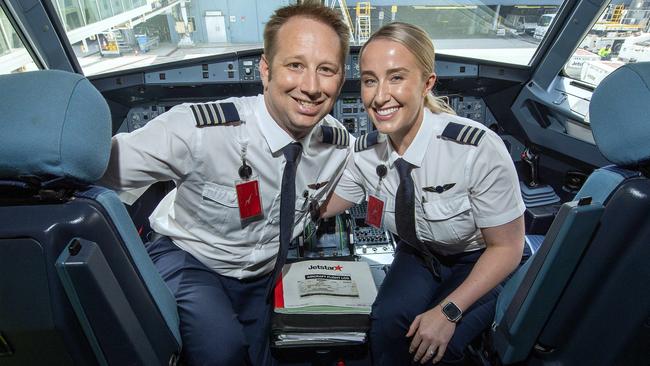 Jetstar pilots  Matthew Wills and Rachel Blair-Wills who met at work and now are married and fly together get into Valentines Day mood in the cockpit of a Jetstar Aircraft  at Adelaide Airport .Thursday,February,13,2025.Picture Mark Brake