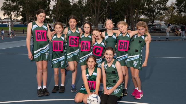 Geelong Amateurs Pearls under-11 netball team pull their funniest faces.