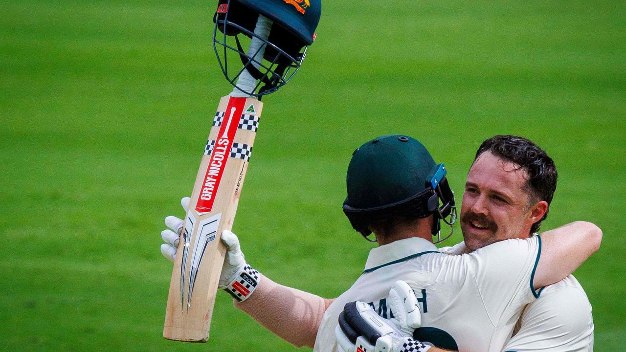 Lovely scenes after Head brought up his hundred. Photo by Patrick HAMILTON / AFP