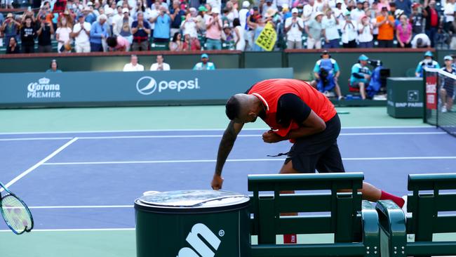 Nick Kyrgios of Australia smashes his racket