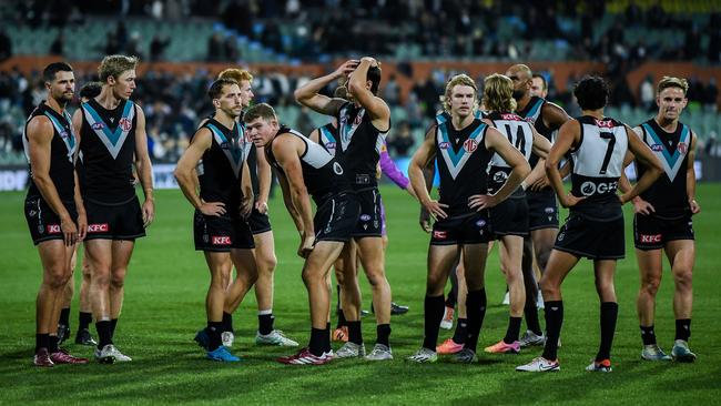 ADELAIDE, AUSTRALIA – MAY 30: Port players feel the loss after losing the round 12 AFL match between Port Adelaide Power and Carlton Blues at Adelaide Oval, on May 30, 2024, in Adelaide, Australia. (Photo by Mark Brake/Getty Images)