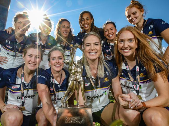 Sunshine Coast Lightning players pose for a photograph their championship trophy in Perth, Monday, August 27, 2018. The Sunshine Coast Lightning beat West Coast Fever to win the 2018 Super Netball competition on Sunday. (AAP Image/Richard Wainwright) NO ARCHIVING