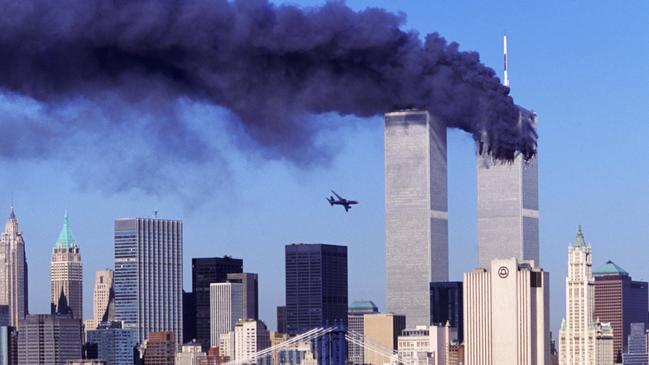 United Airlines Flight 175 approaches the World Trade Centre’s south tower, with smoke streaming from the first terror strike by one of four passanger jets hijacked in the US on September 11, 2001. Picture: Robert Clark